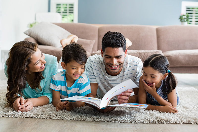 Family Reading a Book Together